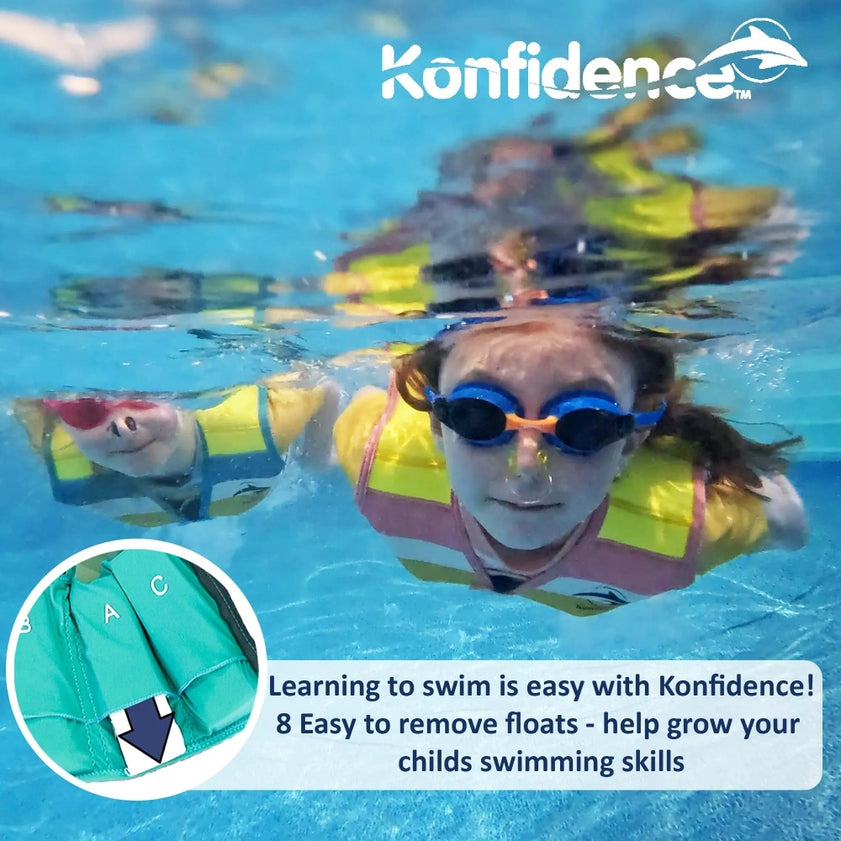 Child wearing a striped yellow float jacket and goggles underwater with Konfidence branding.