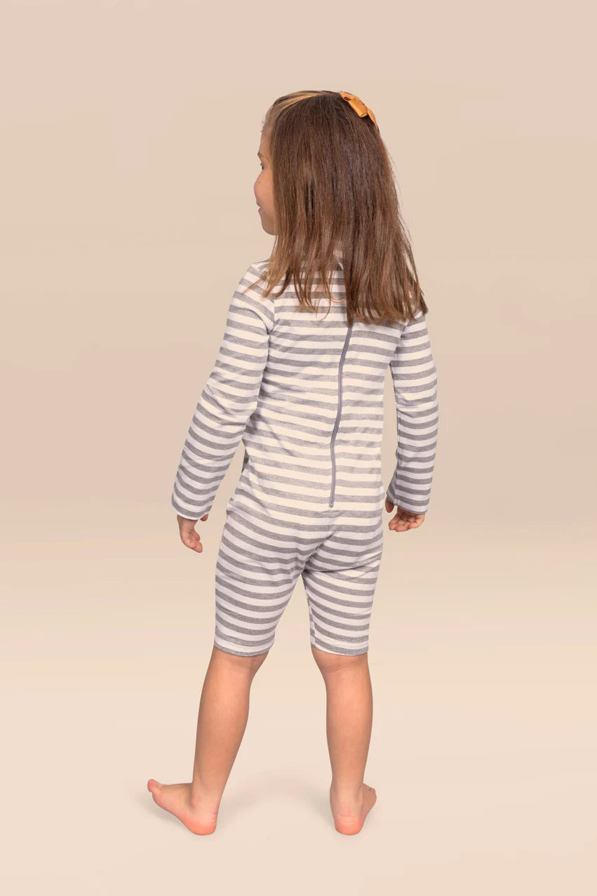 Back view of child wearing KayCey grey and white striped zip back jumpsuit showing secure rear fastening