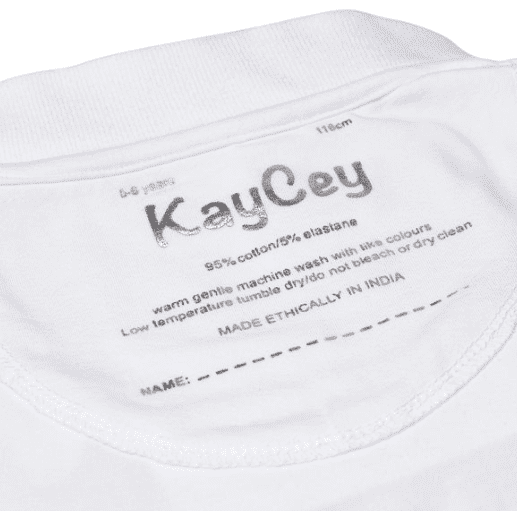 Close-up of the inside neck label of a white polo, showing the brand name &
