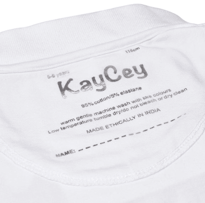 Close-up of the inside neck label of a white polo, showing the brand name &