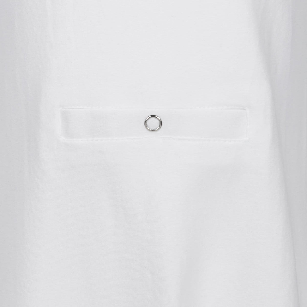 Close-up of a white fabric garment showing the tube feeding pocket with popper 