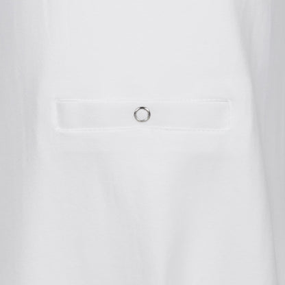 Close-up of a white fabric garment showing the tube feeding pocket with popper 