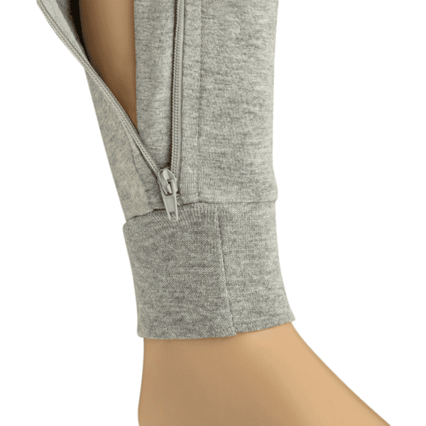 Gray zip-up  on a mannequin leg against a white background
