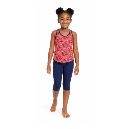 Girl wearing Kes-Vir zebra incontinence tankini with navy three-quarter swim leggings